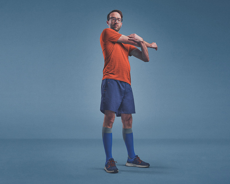 Andy stretching his arm, wearing JOBST Sport compression socks. Andy stretching his arm, wearing JOBST Sport compression socks.